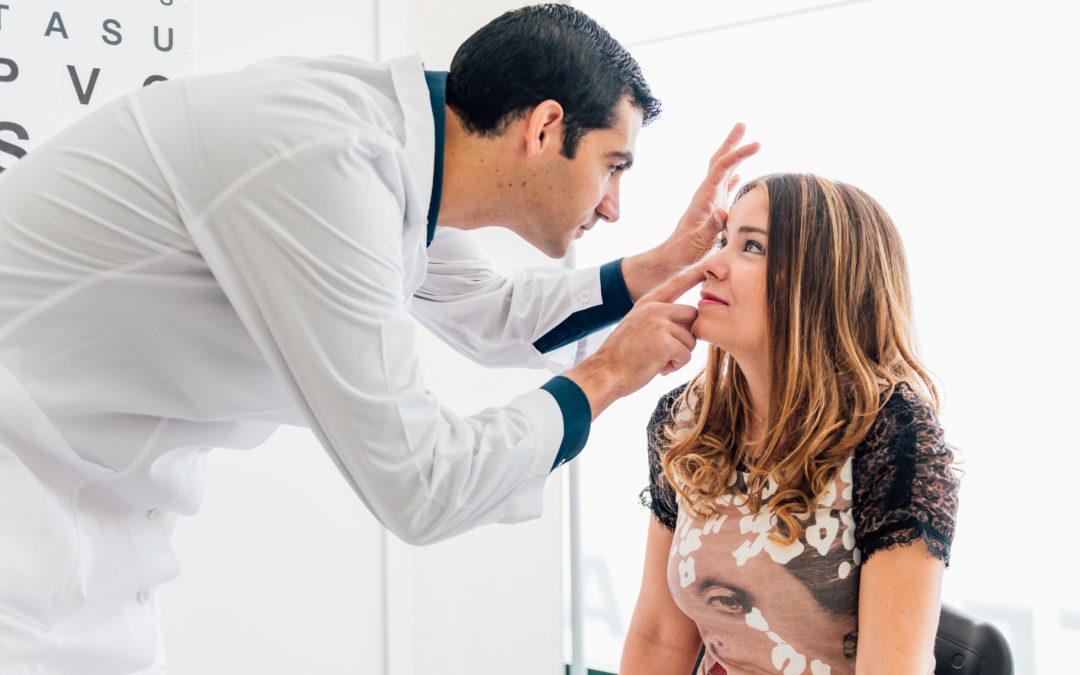 Doctor performing eye exam at Buffalo Ophthalmology