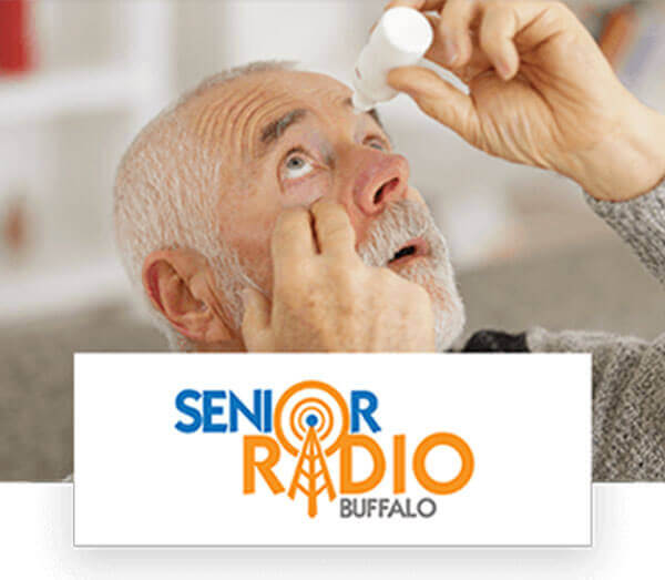Old man using eyedrop