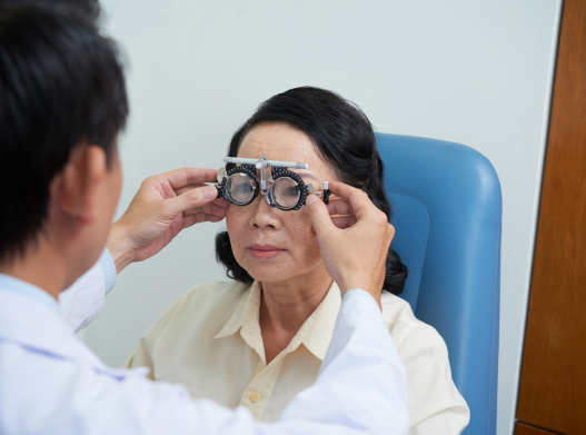 eye doctor with her old aged patient